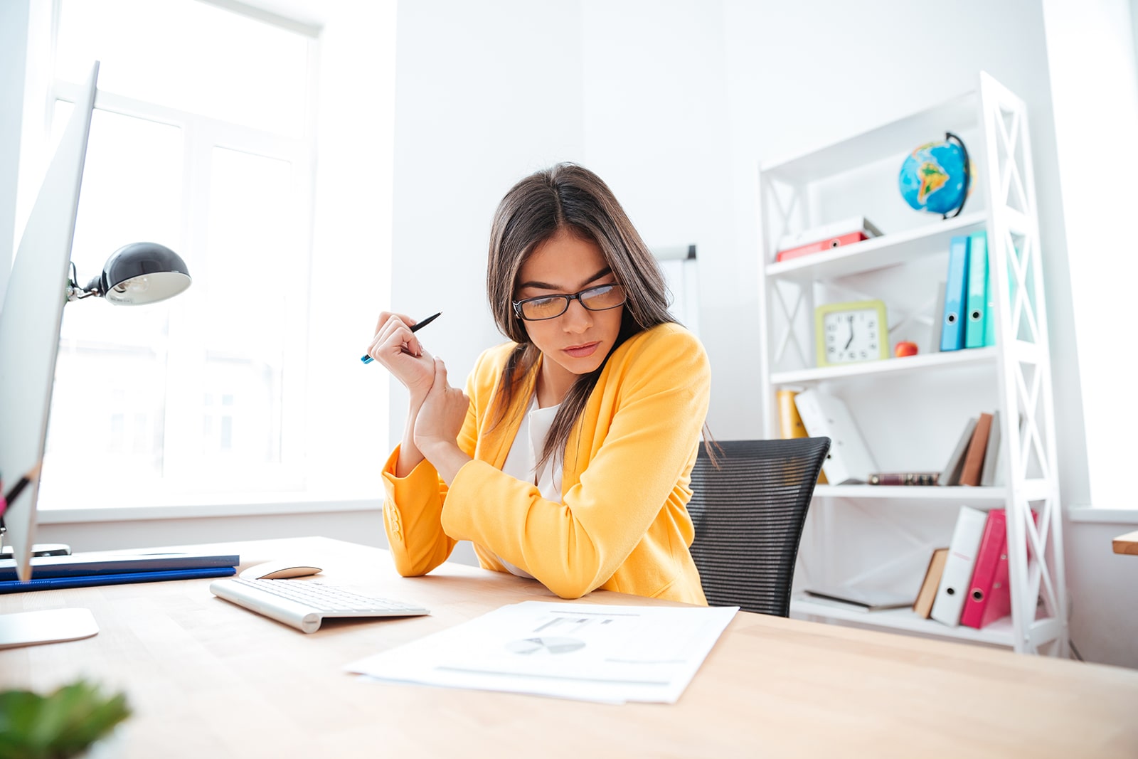 businesswoman-analysing-document-P8WSNMC-min